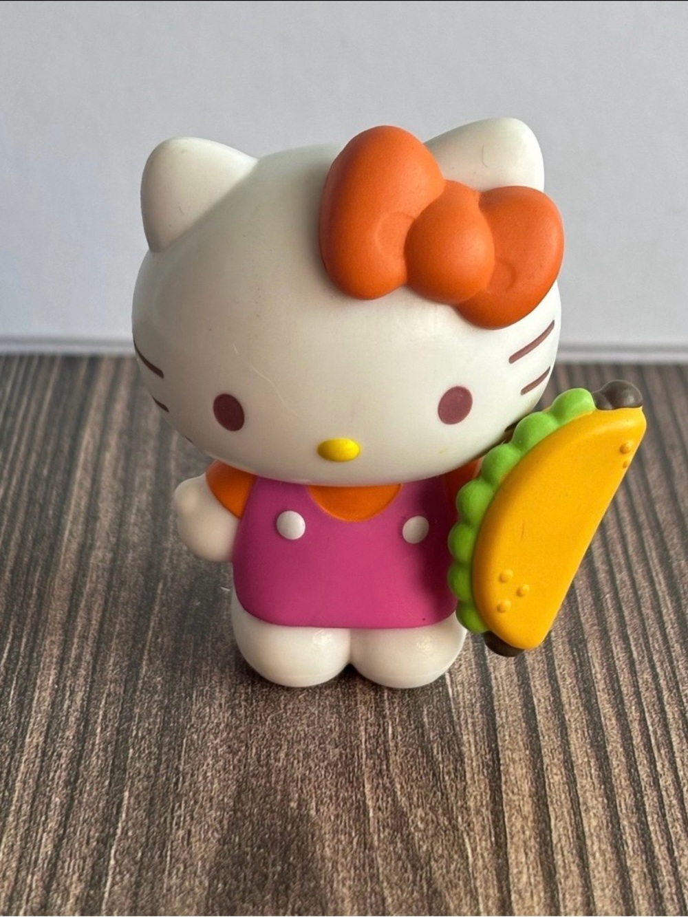 Sanrio Hello Kitty Pink Figure with Orange Bow and Yellow Taco Accessory